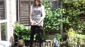 Thigh-booted Crossdresser Strokes Outdoors