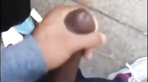 Black amateurs stroke big cocks outdoors