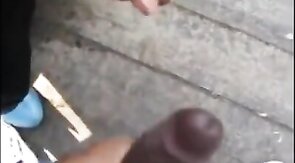 Black amateurs stroke big cocks outdoors