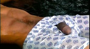 Impressive black dude is playing with his massive wiener