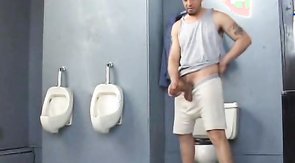 Office worker is masturbating his dick in the toilet