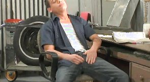 Impressive muscled workers are tasting each other's sausages