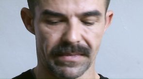 Bearded man is getting sucked by two muscled hunks