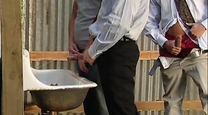 Skinny young man is handling two hard cocks