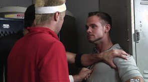 Two men are using their trainer as a sex doll