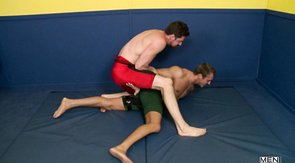 Fighters are practicing oral sex on the blue mat