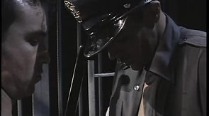 Dark-haired dude sucking his guard's fat cock