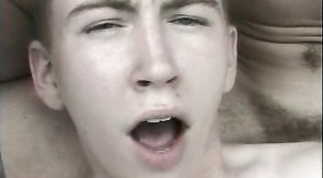 Dark-haired twink jerks off next to his boyfriend