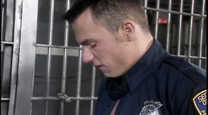 Two police officers sucking on each other's meat nightsticks