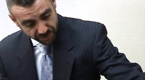 Two hot guys in suits stroking each other's cocks