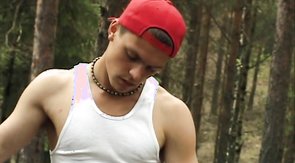 White tank-top brunette dude sucking cock in the woods