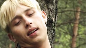Blond-haired boy sucking cock in the woods