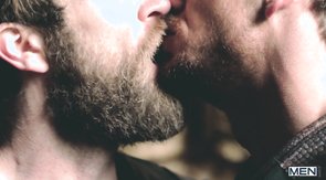 Dark knights in leather are kissing in a sexy way