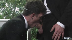 Alluring men in black are enjoying outdoor oral sex