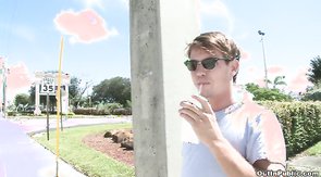 Smiling jock seducing horny boy for a public blowjob