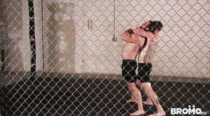 Two guys wrestle and end up fucking asses in a cage