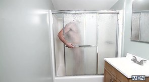 Shower blowjob scene featuring two big-dicked studs