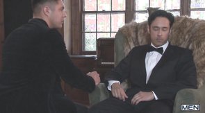 Jacked-up dude in a tuxedo gets a sloppy blowjob
