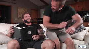 Two cheerful bears making out on a couch