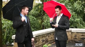 Two guys with umbrellas end up in a threesome