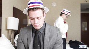 Two hat-wearing dark-haired guys love blowjobs on a bed