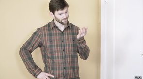 Bearded older guy makes out with his boyfriend on a bed