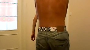 Jeans-wearing stud in black undies sucking his boyfriend's cock