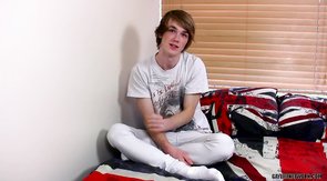 Brown-haired twink in all white enjoying his masturbation session