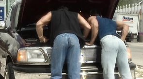 Two truck drivers are demonstrating their awesome muscled bodies