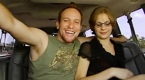 Nerdy girl sitting with a new candidate at the backseat