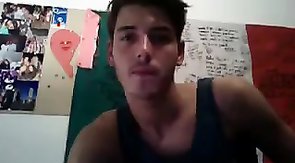 Smiling boy shoving fingers in his friend's asshole