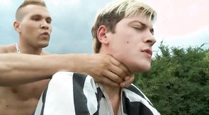 Caged boyfriend is getting treated by two horny men in black