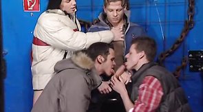 Seduced partner is sucking multiple hard boners on the knees