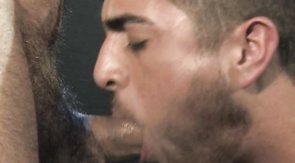 Sexy as hell hunk passionately sucks a massive dick in dark room