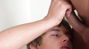 Sweet youngster with beautiful face is sucking a hard dick of his boyfriend