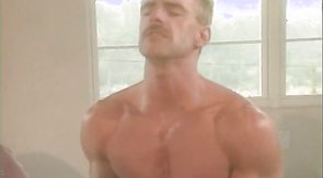 Submissive dude getting viciously spit-roasted on a beach