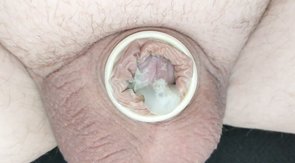 Pulling off condom from small spent dick