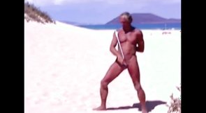 Tanned guy on beach in tiny string thong (temporarily!)