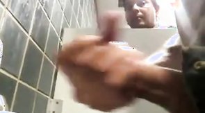 Boys playing in public toilet