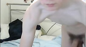 Youngster with bushy cock playing in front camera