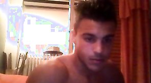 Gorgeous muscular guy demonstrate his amazing shape