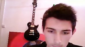 Skinny young guitarist undressing and masturbating