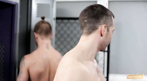 Sporty boyfriends relaxing in the locker room after workout