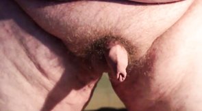 Fat boys tiny penis being pushed around while standing up.