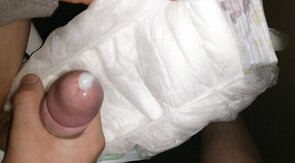 Twink cumming his wet diaper