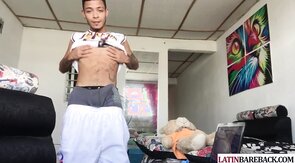 Tattooed twink latino tugging his shaved cock