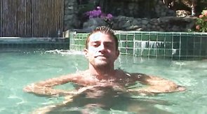 Hot muscled straight is relaxing in the pool naked