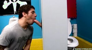 Sweet hunk is taking a juicy dick through the hole in the wall