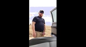 Taking a leak in the country.