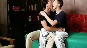 Sensual young partners are enjoying oral sex on the sofa